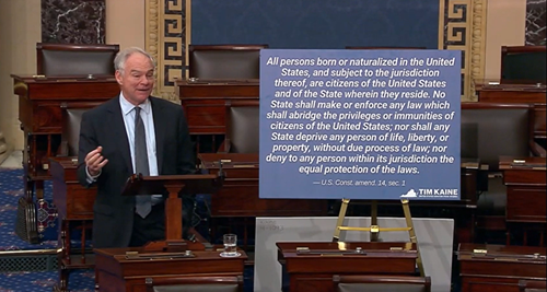 Photo of Senator Kaine talking about birthright citizenship next to posterboard with Section 1 of the 14th Amendment to the U.S. Constitution